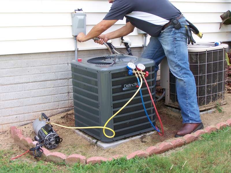 Checking refrigerant levels and recharging if necessary